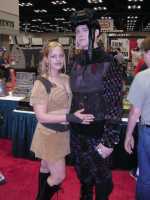 Two convention attendees dressed like Xev and Kai from the television series Lexx