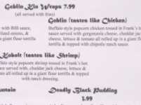A portion of a menu including 'Goblin (tastes like Chicken)' and 'Deadly Black Pudding'